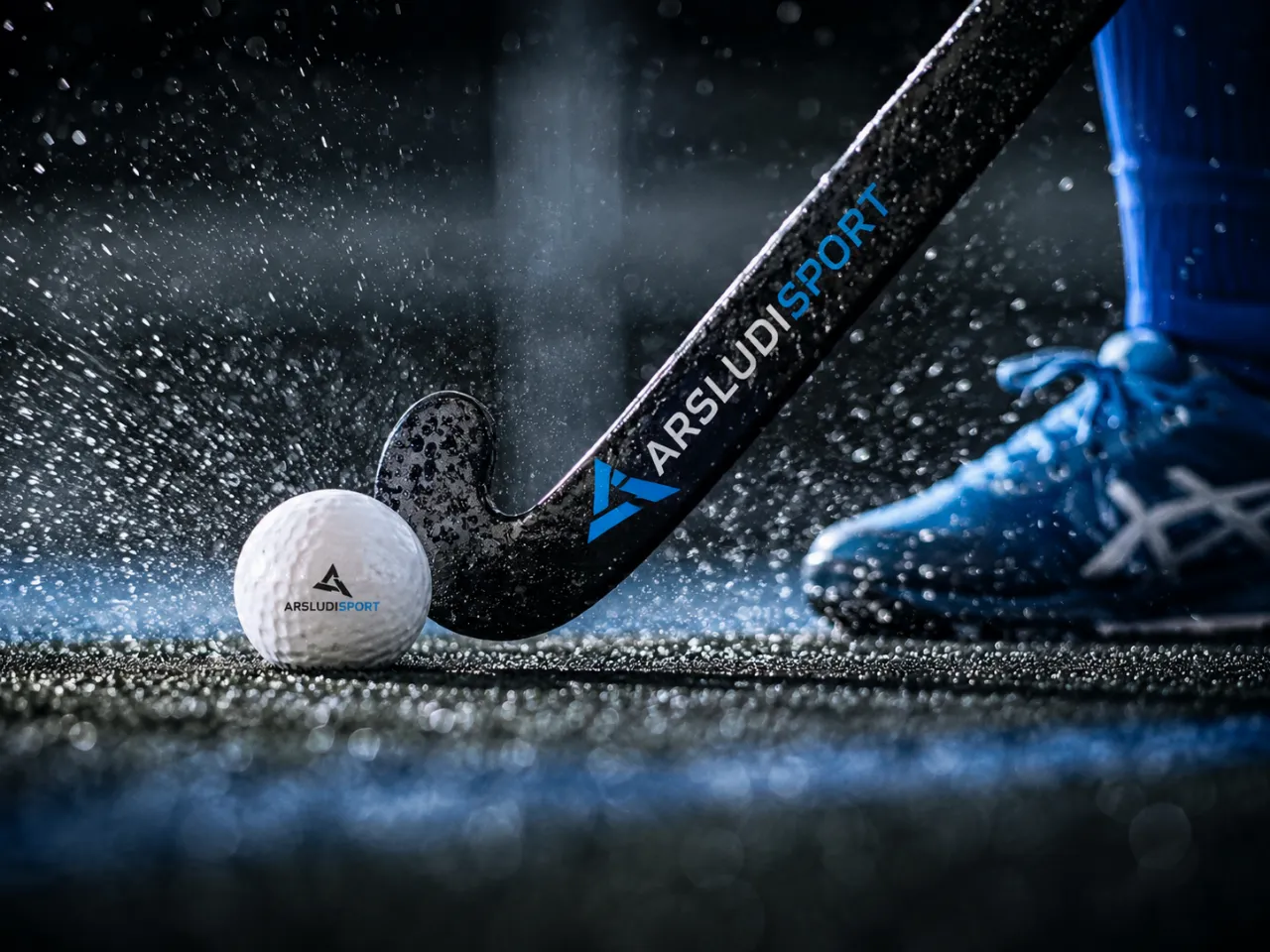 Close-up of a hockey stick striking the ball